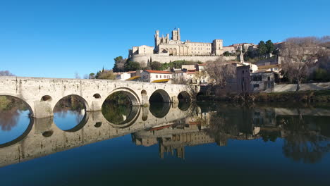 River-Orb,-le-Pont-Vieux-and-cathédrale-Saint-Nazaire-in-Béziers-aerial-drone